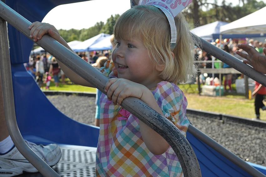 Sasha Mesa, 3, plays on the slide.