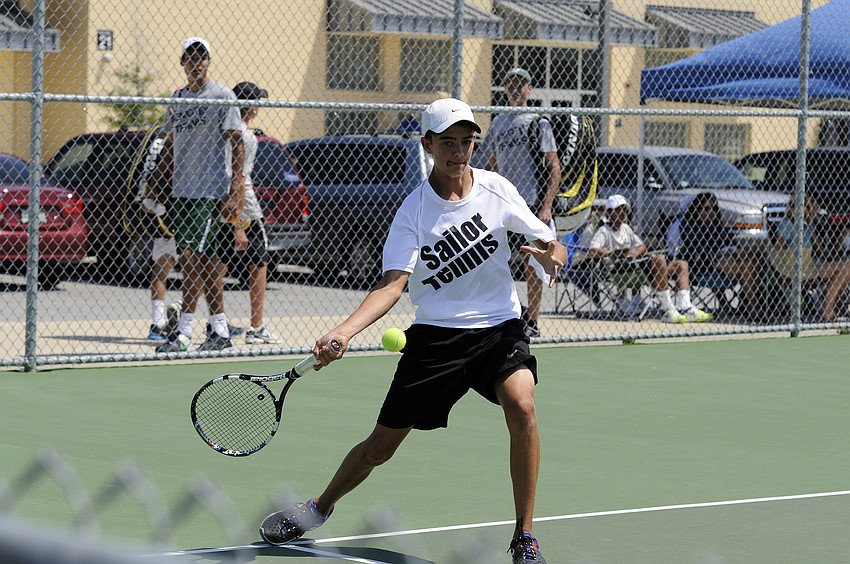 Sarasotaâ€™s Eric Scarlett returns a serve during the Sailors No. 1 doubles semifinal versus Braden River.