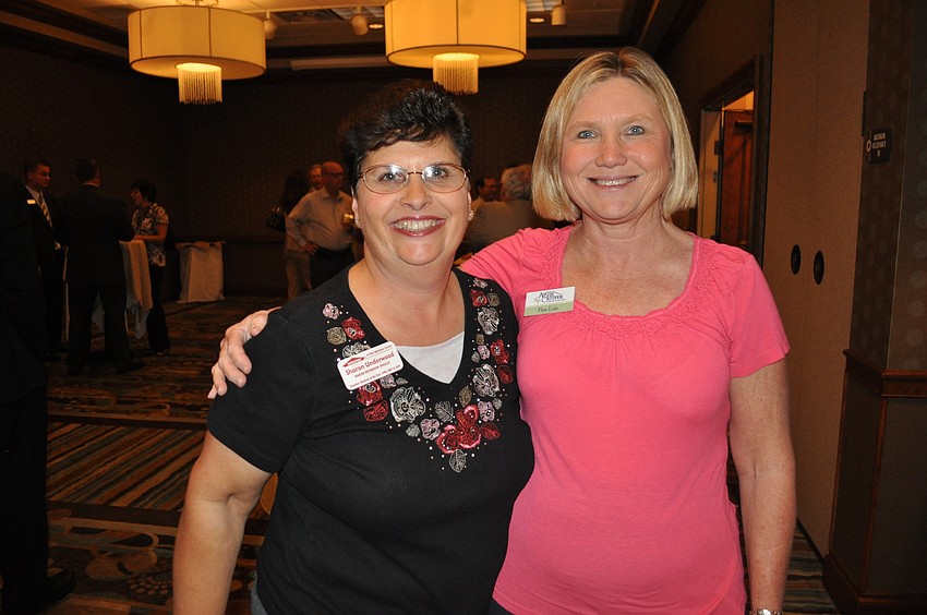 ServProâ€™s Sharon Underwood, who is also on the business alliance events committee, with Pam Lutz of Austin Outdoor