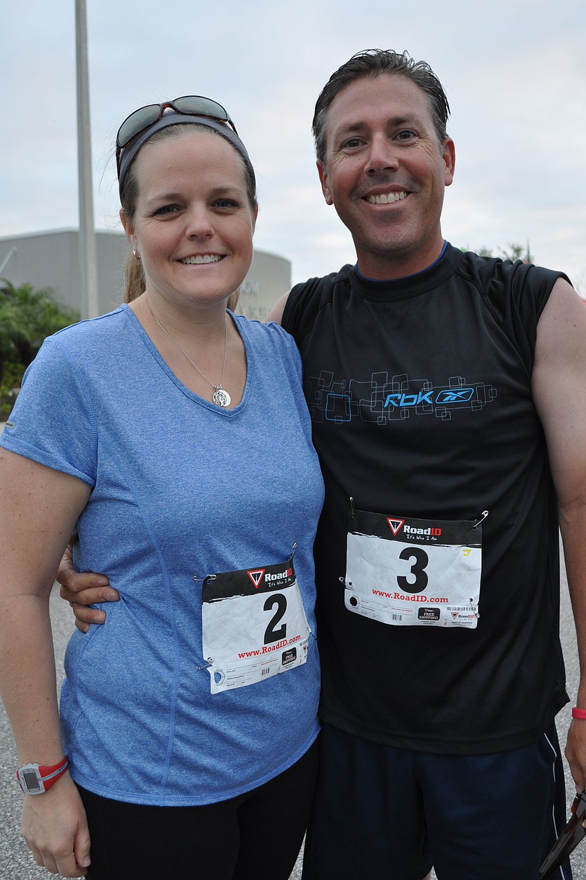 Amy and Jaymie Bane pushed their 1-year-old Bennett, as their other children â€” Carter and Keirlyn â€” also ran.