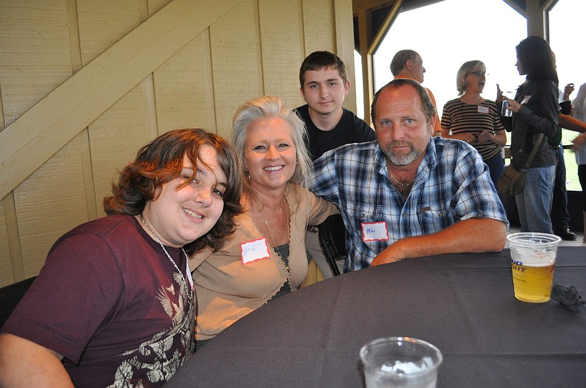 Joshua and Heidi Moore with Michael and Justin (back) Falconer