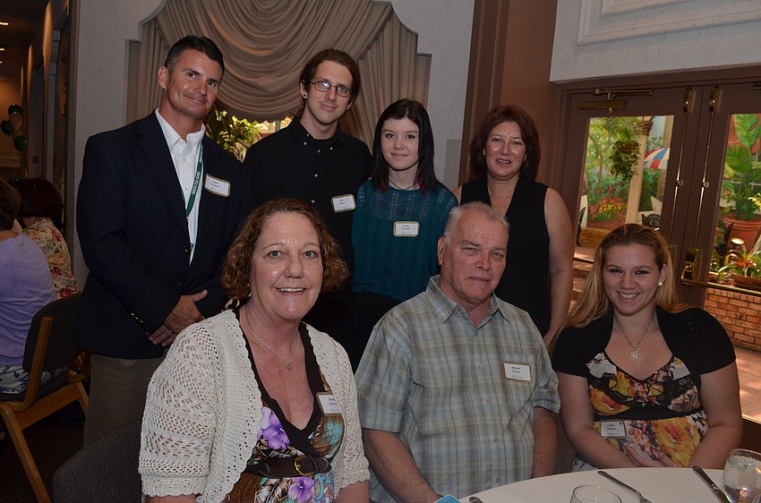 (standing) Venice High School Principal Jack Turgeon, Alex Wood, Carly Delellis and her mother Denise. (seated) Sarah and Bryant Groves with their granddaughter Natalie Hawkins