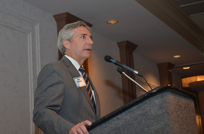 Phil Delany of Northern Trust Bank welcomes guests to the celebration luncheon.