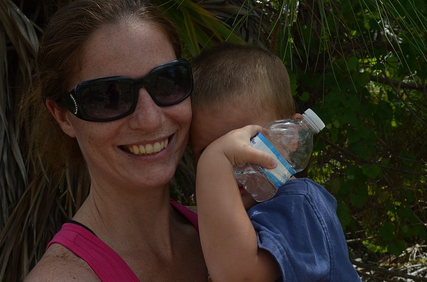 Jaxon Sellner was ready for a nap as his mother Rachel carried him out.