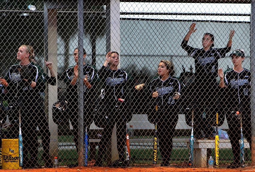 Lakewood Ranch Lady Mustangâ€™s cheer from the dugout.