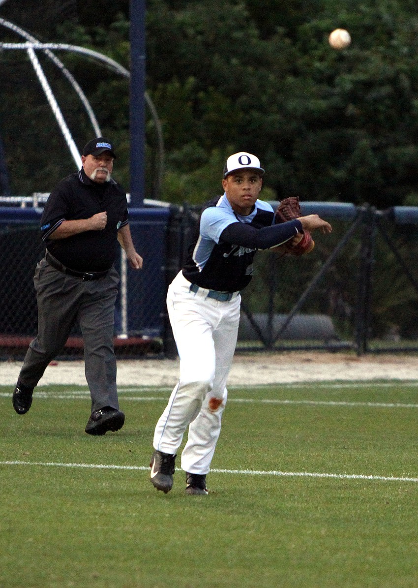 Out-of-Door Academyâ€™s Desmond Lindsay, No. 42, throws the ball to first base.