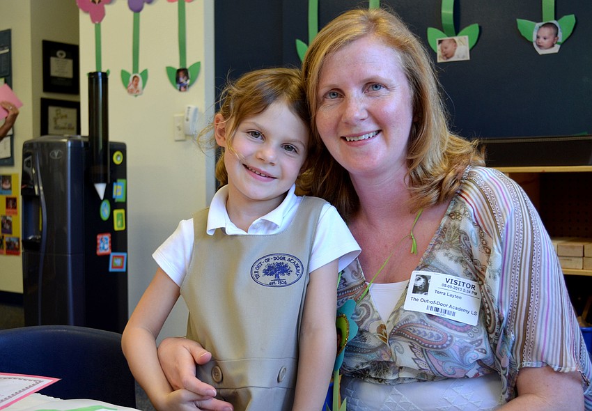 Kate poses hugs her mother, Terra.