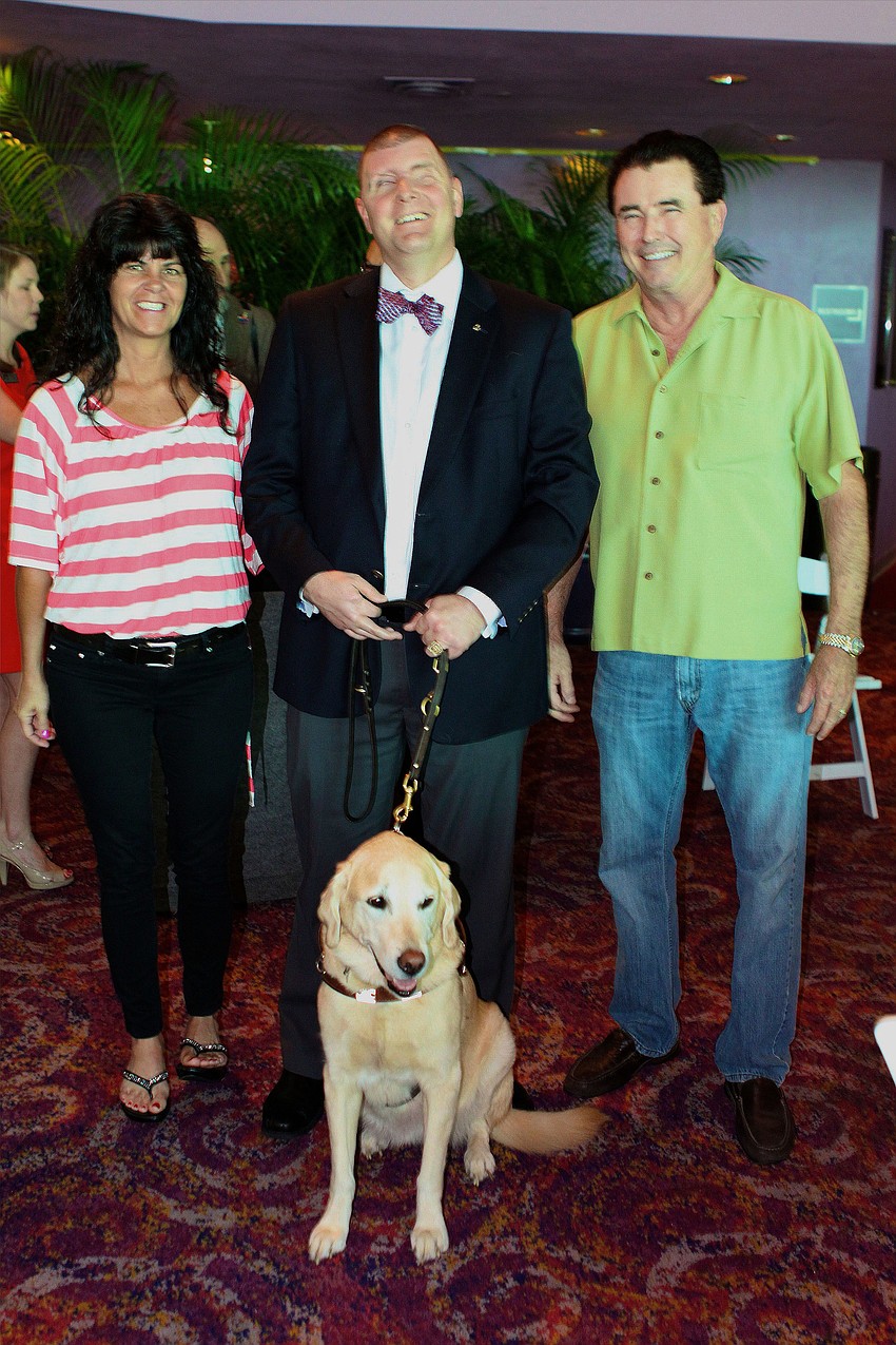 Nikki Mansfield, Corporal Michael Jernigan, USMC, with his guide dog Brittani, 8, and Doug Mansfield.