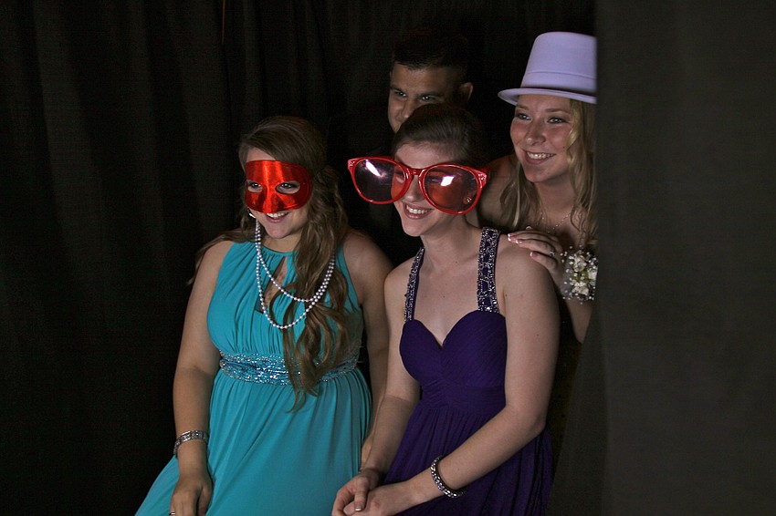 Clayton Reese, Tiffany Tellbuecheo, Nichole Peal and Samantha Linares have fun in the photo booth.