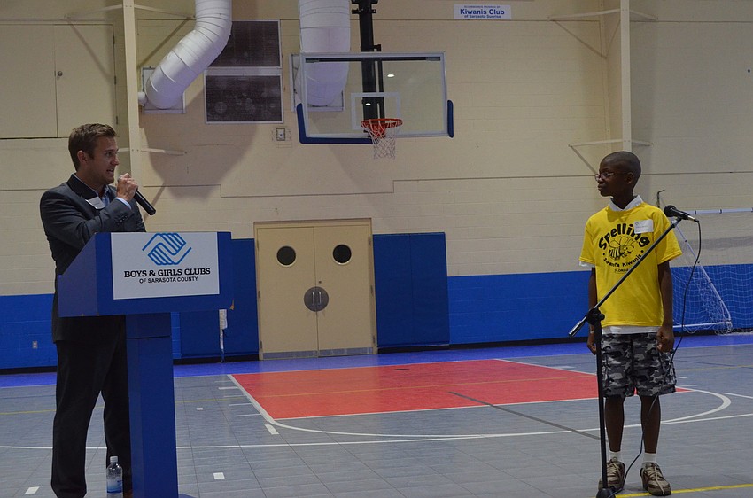 Larry Bowman asks fourth grader Tyrell Bruce to spell the word angry.