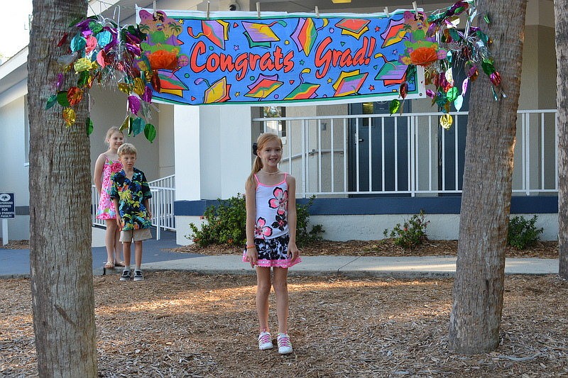 Kendall D. crosses the mulch