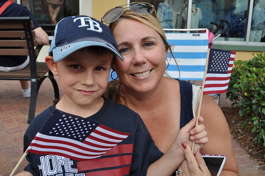 Jackson Riffe enjoys the parade with his mom, Amy.
