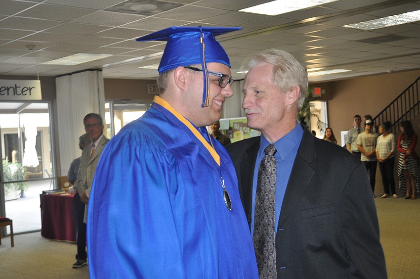 Sarasota Christian School instructor Steve Fisk sent off graduate Alex Sommers.