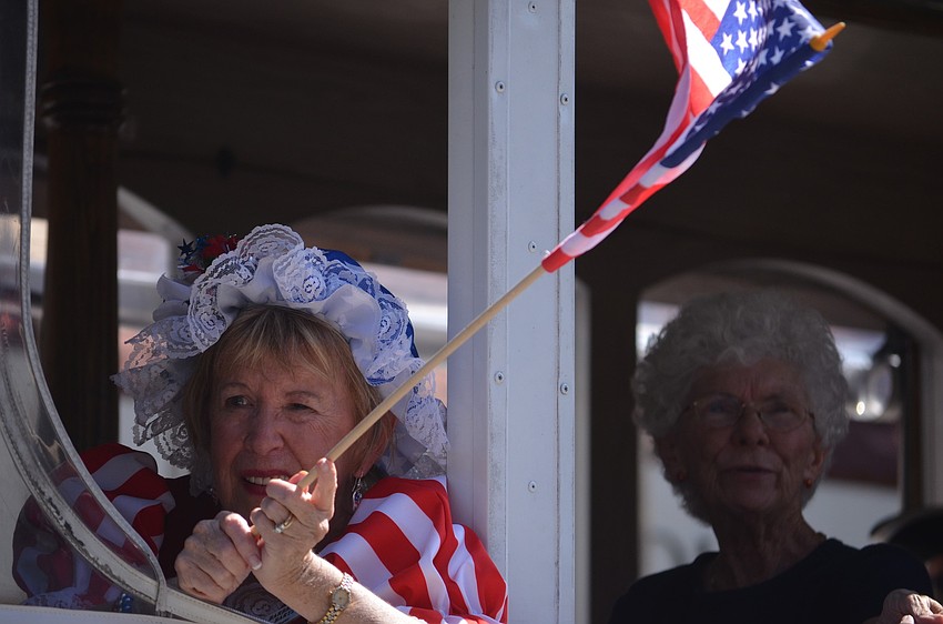Barbra Ross Bartz waved her flag for Daughters of the American Revolution Myakka Chapter in the Memorial Day Parade.