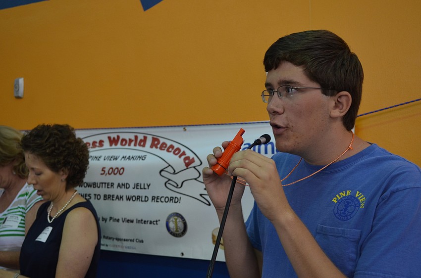 Senior and founder of the Interact Club at Pine View Jeremy Kemp gets ready to blow the whistle signaling the beginning of the sandwich making.