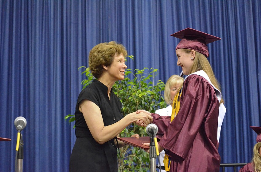 Lauren Robertson accepts her diploma.