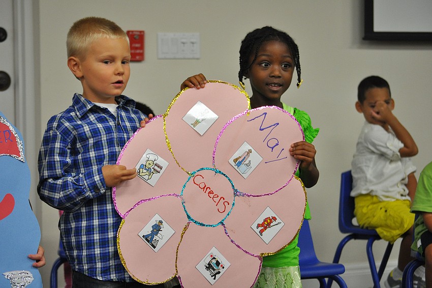 Michael Cole and Breanna Ward, of Kiddie Academy, told parents about their lessons about careers.