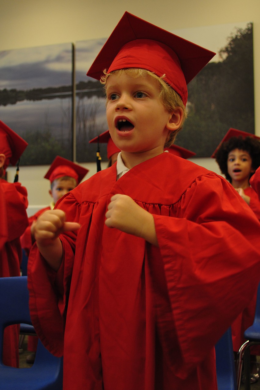 Thomas McLaughlin performs motions as he sings â€œThis Land is Your Land.â€