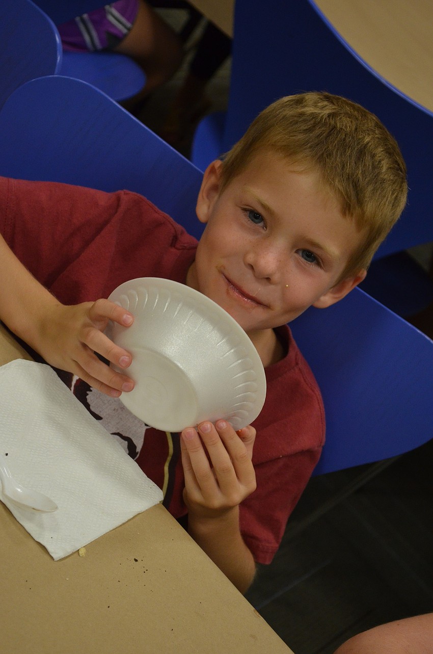 Reese Nippert, 7, gets ready to bite into her favorite ice cream, vanilla.