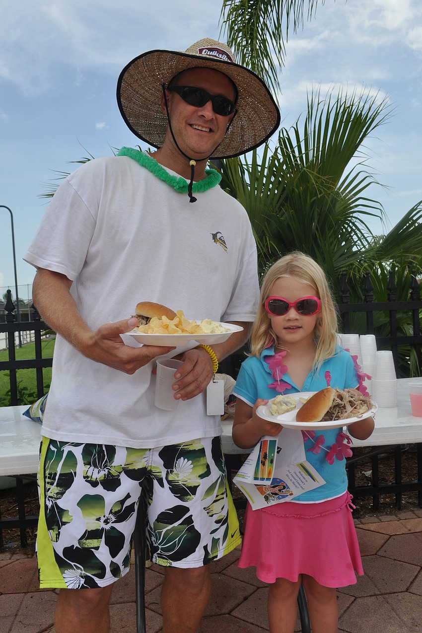 David Martin and his daughter, Sara, were dressed for the luau.