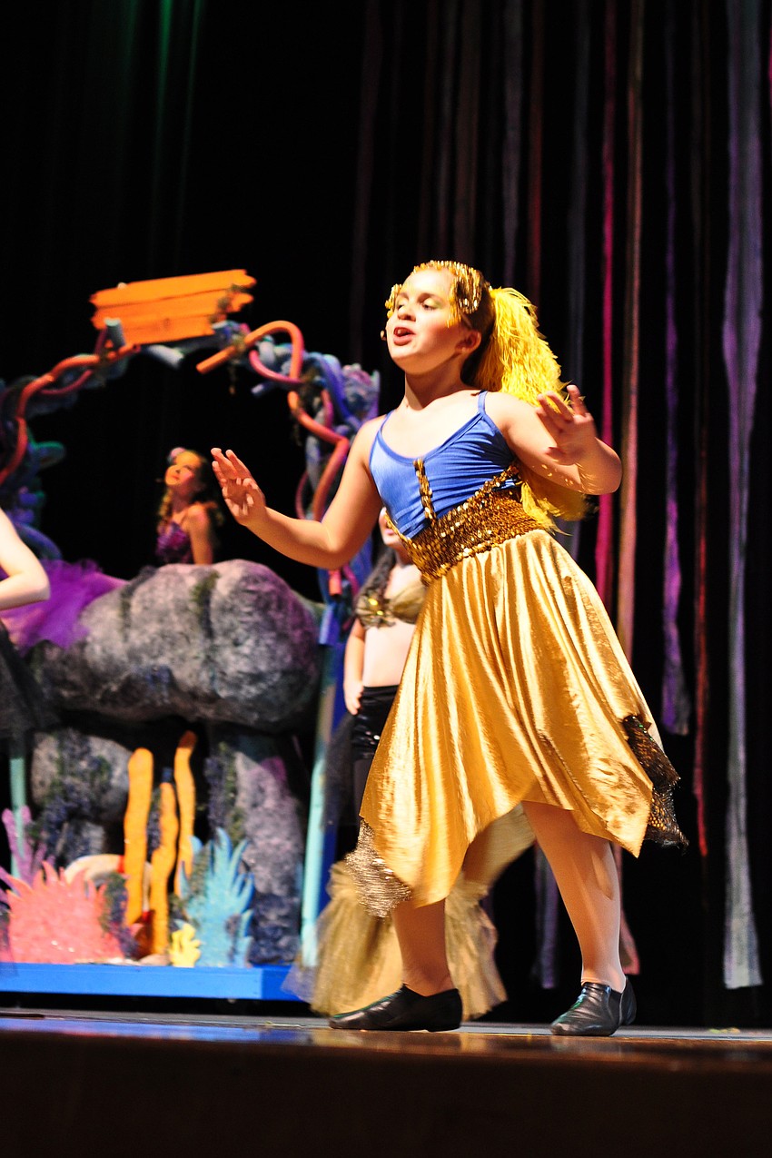 Paige Alter, who plays the character of Flounder, dances.