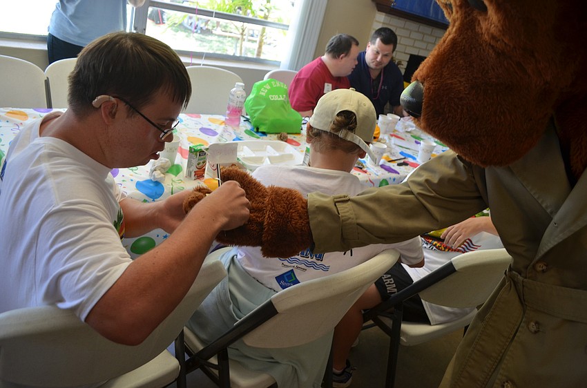 Patrick Burke receives stickers and a pencil.