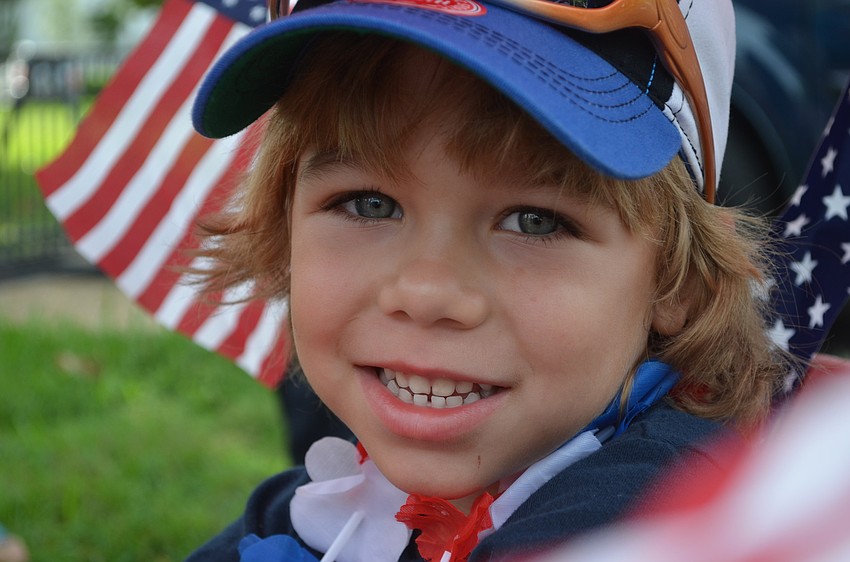 Finn Fluker, 4, rides in a wagon in the parade.