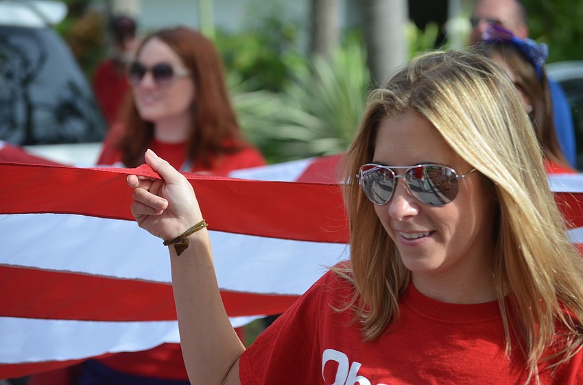 Leslie Gnaegy walks with Observer staff members in the parade.