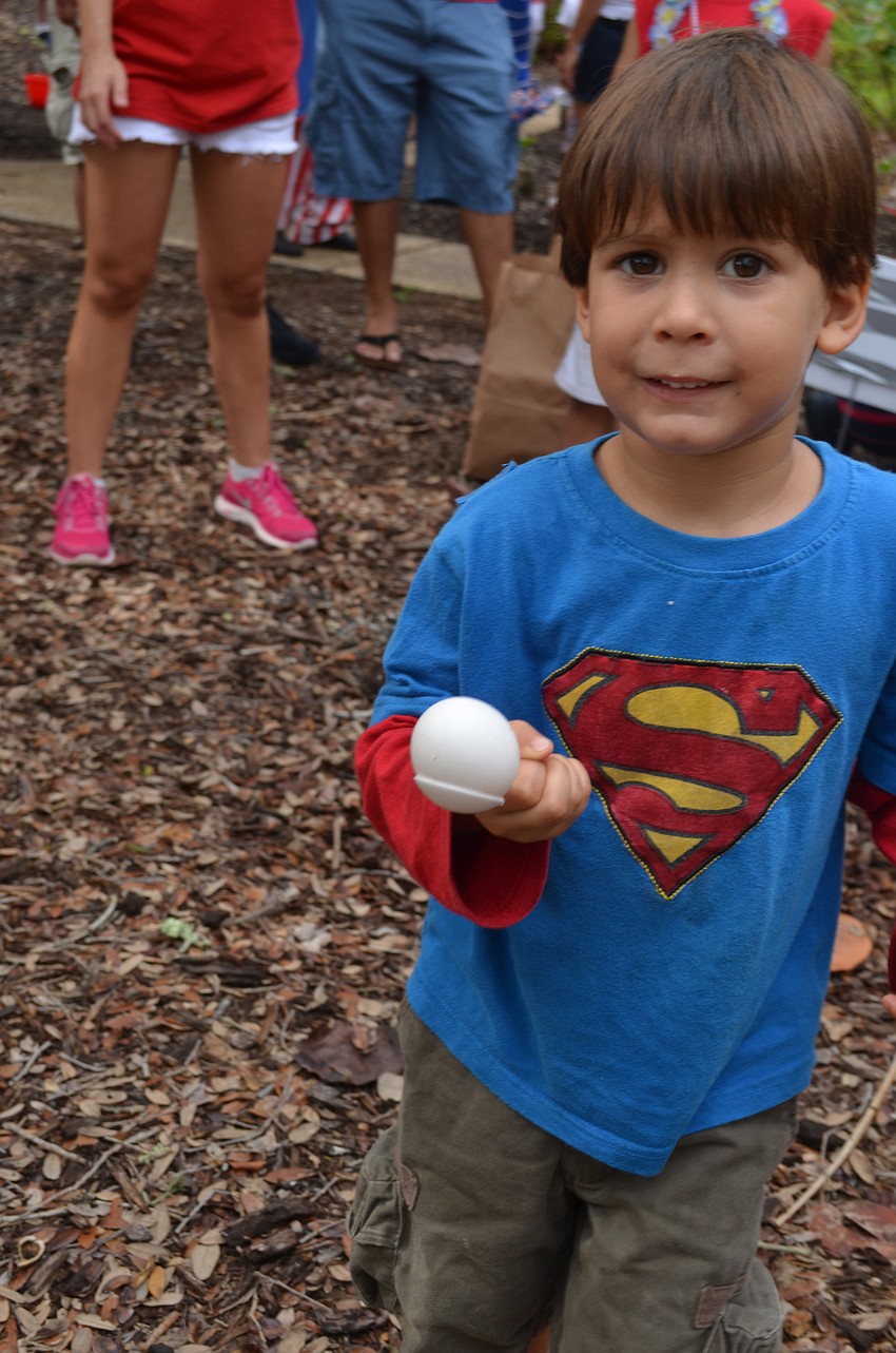 Mateo Trujillo, 4, balances an egg as he races to be first.