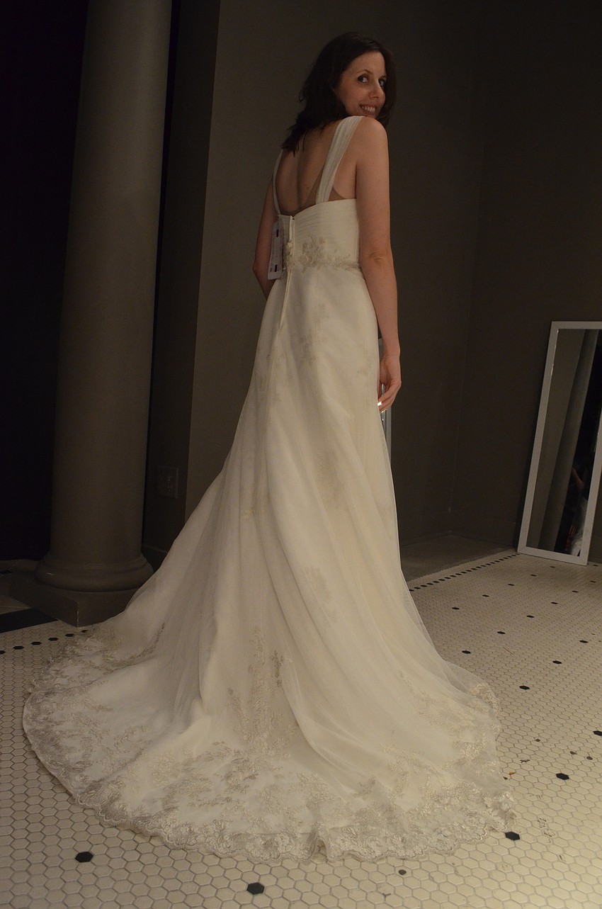 Michelle Wollenberg of Sarasota tries on her very first wedding gown.
