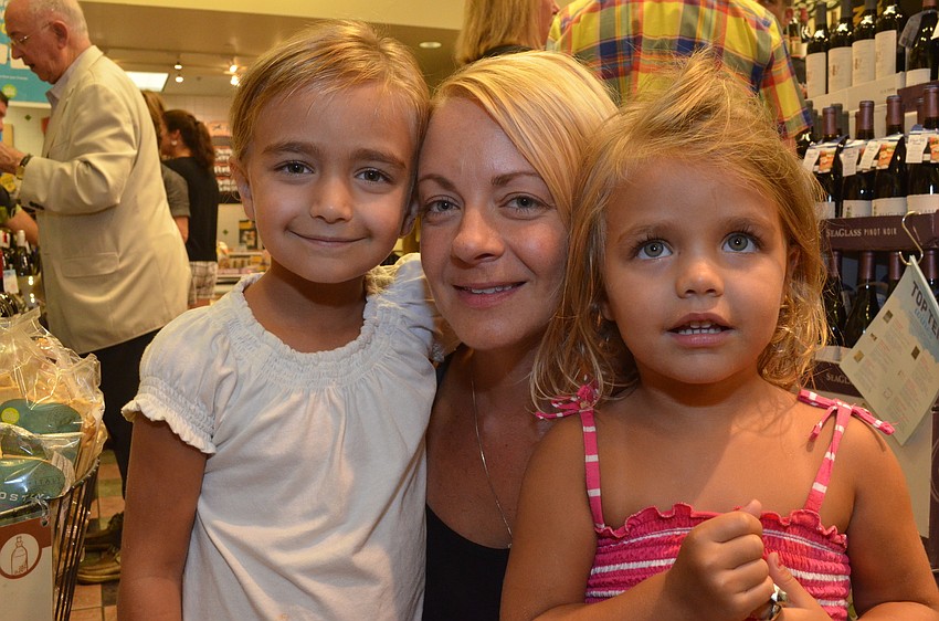 Stella Misantoe, 5, with her mother Karen and three-year-old sister Alex