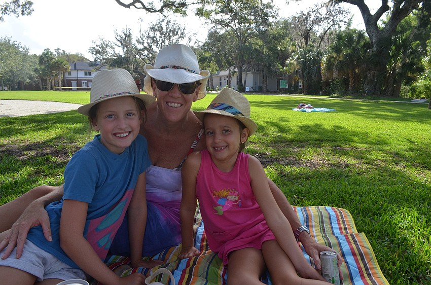 Sophie Reilly, 9, with her mother Michelle and little sister Cara, 6