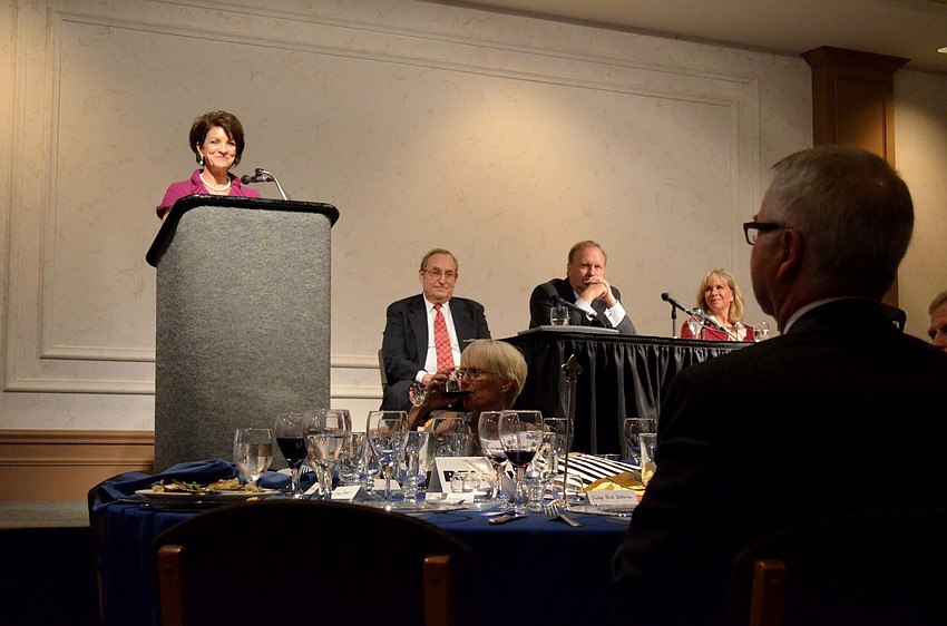 Judge Rick De Furia watches as Lynette Mancuso speaks.