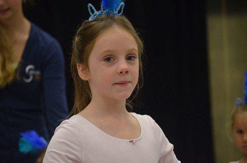 Sienna Cook, 6, learns that it is important to stretch.