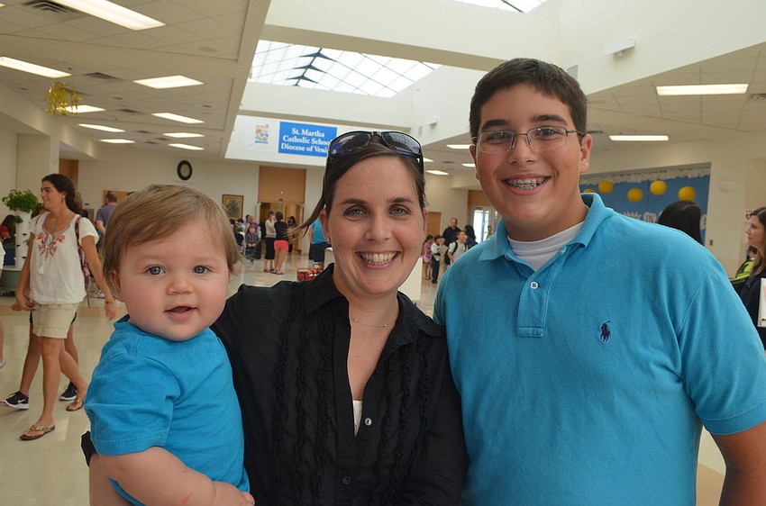 Cooper Johs, 1, and his mother Meghan came with 13-year old brother Matthew Fasold to see his school.