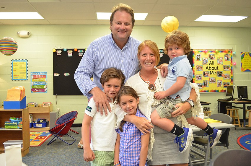 Andy and Emily Tack with their children Charlie, Ula and Beau.
