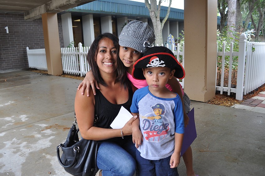 Jackie Ngo with her daughter, Brianna, a third grader on the Tara Elementary dance team, and son, Nicholas
