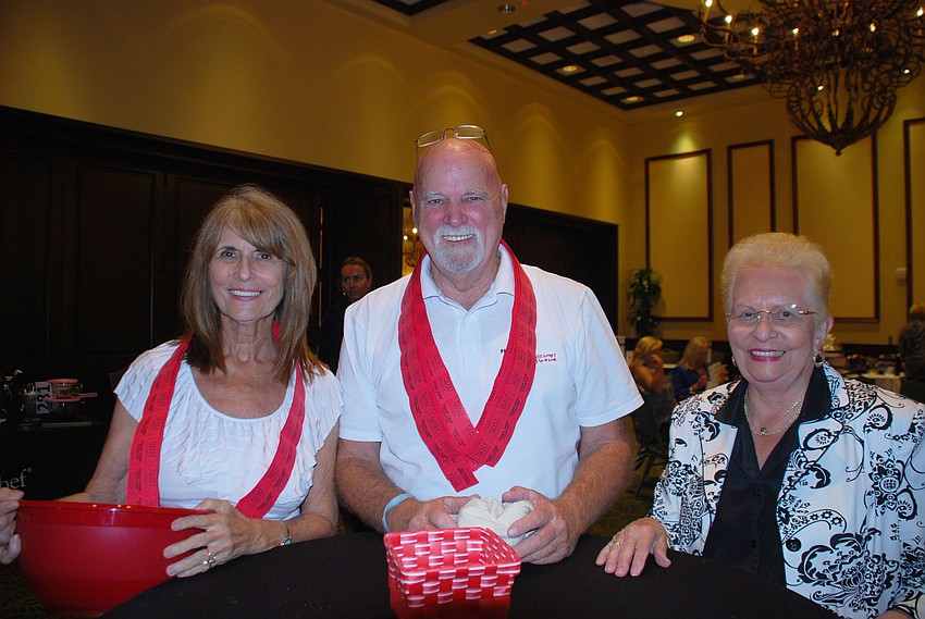 Lorraine Hickok, Al Eunice, and Ruby Plummer sell raffle tickets