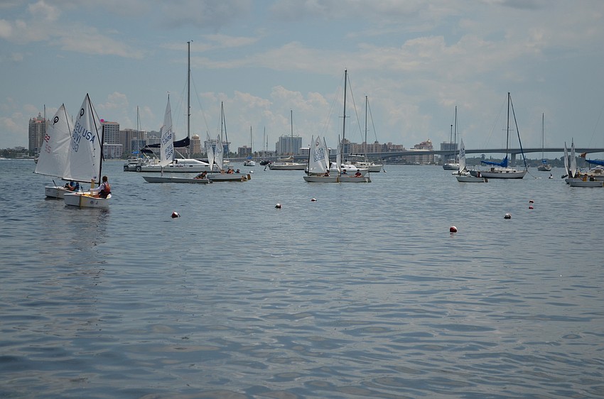The boats begin to head out as the race starts.