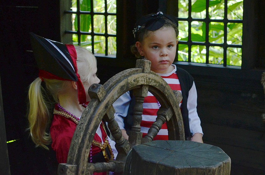 Makayla Digou and Brooklyn Williams steer the pirate ship.