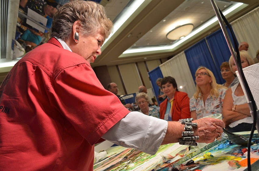 Taylor Ikin from Tampa shows an audience how to achieve a similar look to her work.