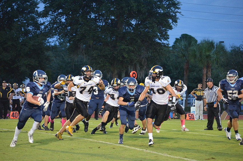Running back and defensive back Jason Fineberg runs towards first down.