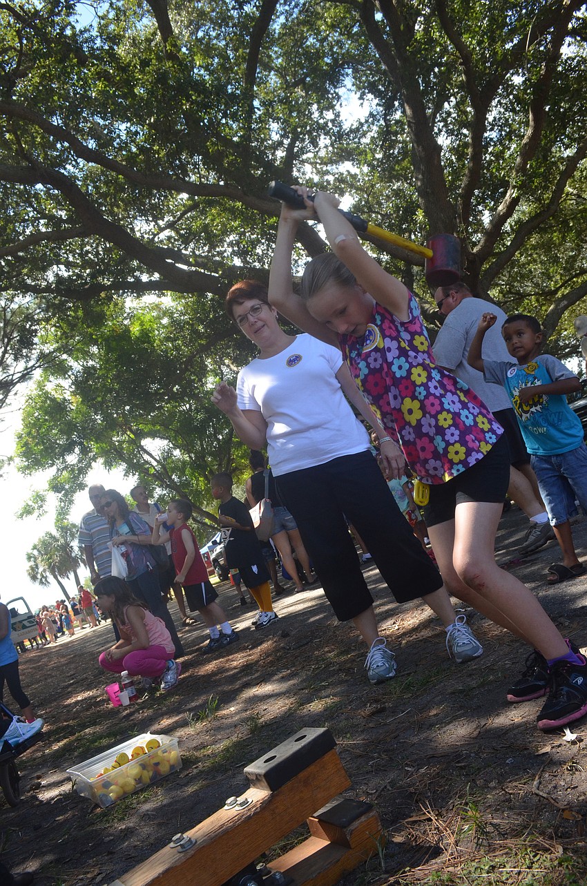 Leah Brown, 9, hits the target at the hammer game.