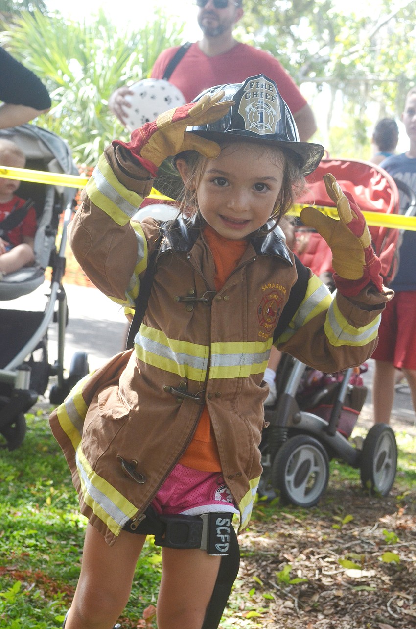 Rachel Storino, 3, goes through the Junior Fireman Combat Challenge.