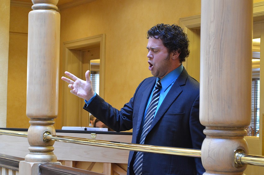 Tenor Jon Jurgens performs in the balcony of the lobby of Sarasota Opera House for patrons