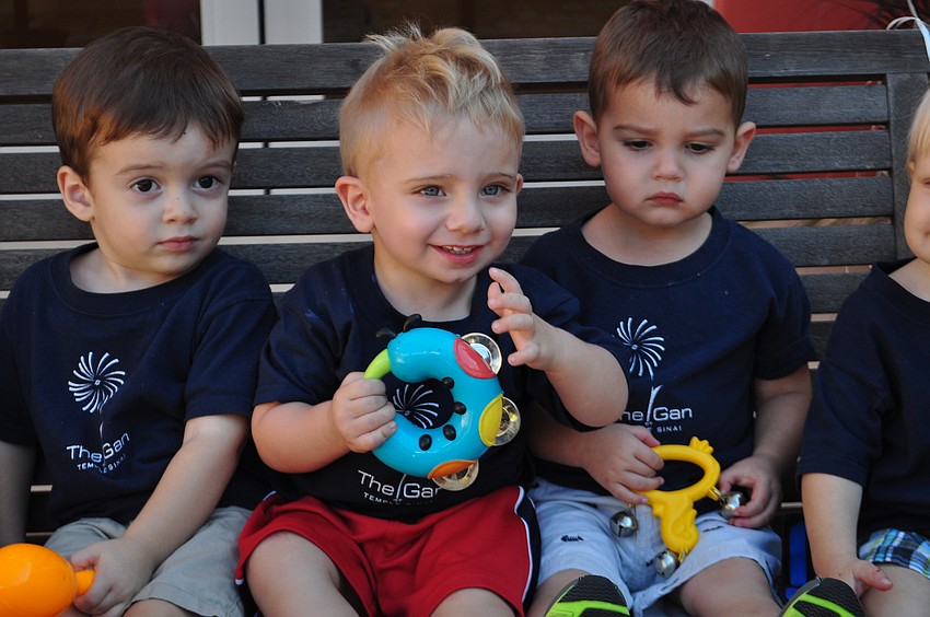 Eric Mattison, Bryce and Ari Cassell cheered on their school mates from the sidelines