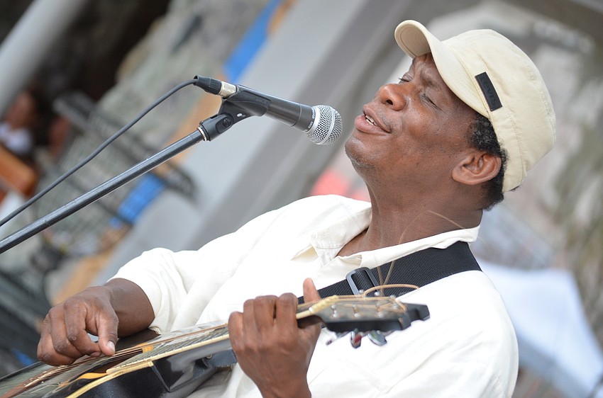 Michelet Innocent entertains attendees with his romantic, beautiful French and Spanish music.