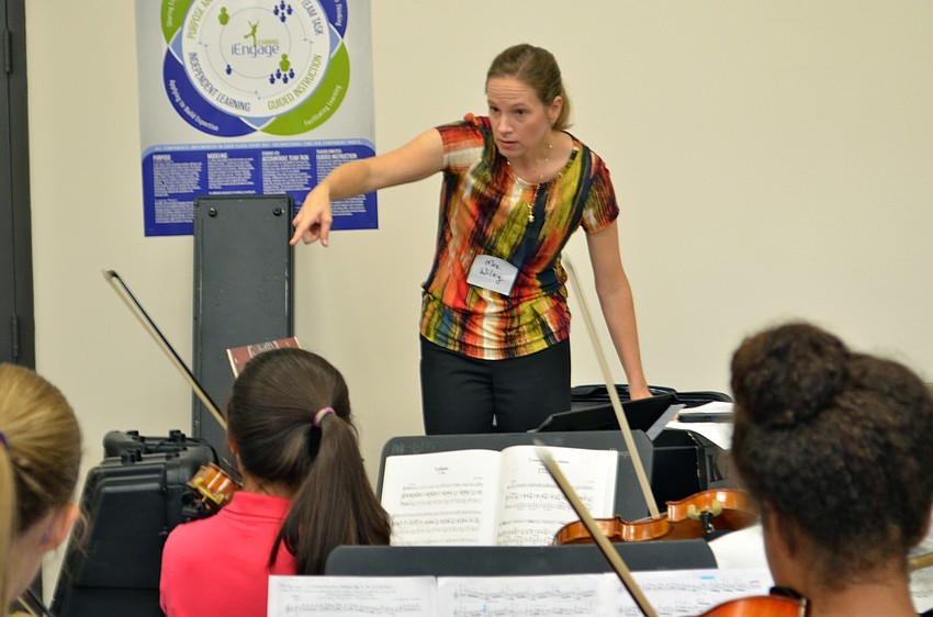 Cynthia Wiley, a Sarasota private school teacher, teaches the left-hand clinic, which works on group intonation, and A-minor tonality.
