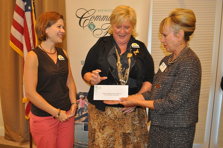 Kristen Theisen and Maribeth Phillips accepted a $2,000 grant for Meals on Wheels PLUS from Diane Brune of the Lakewood Ranch Community Fund.