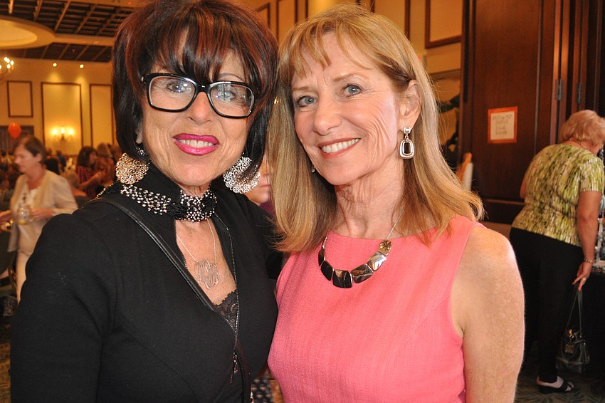 Deborah O'Mara and Peggy Kerwin looked at scarves and other items together.